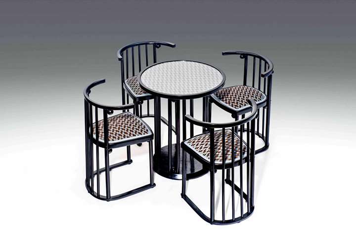 FOUR "FLEDERMAUS" CHAIRS AND TABLE